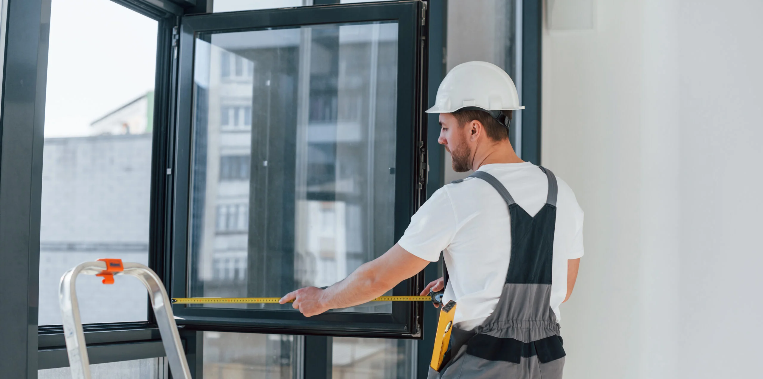 using measure tape repairman is working indoors modern room scaled e1715668310621