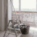 Sunlit room under renovation with tools and ladder, embodying modern DIY projects